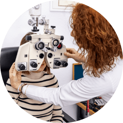 optometrist woman eye examination with phoropter 1 1